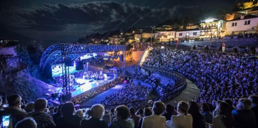 People attending a concert at night at Ancient Theatre of Ohrid