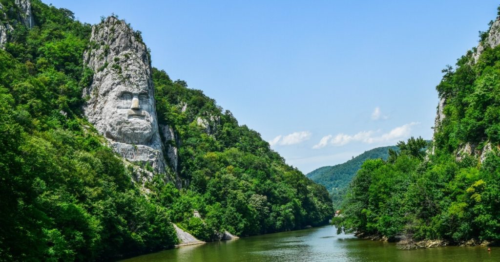 Decebal's sculpted face on Danube's shore - Iron Gates Add-on